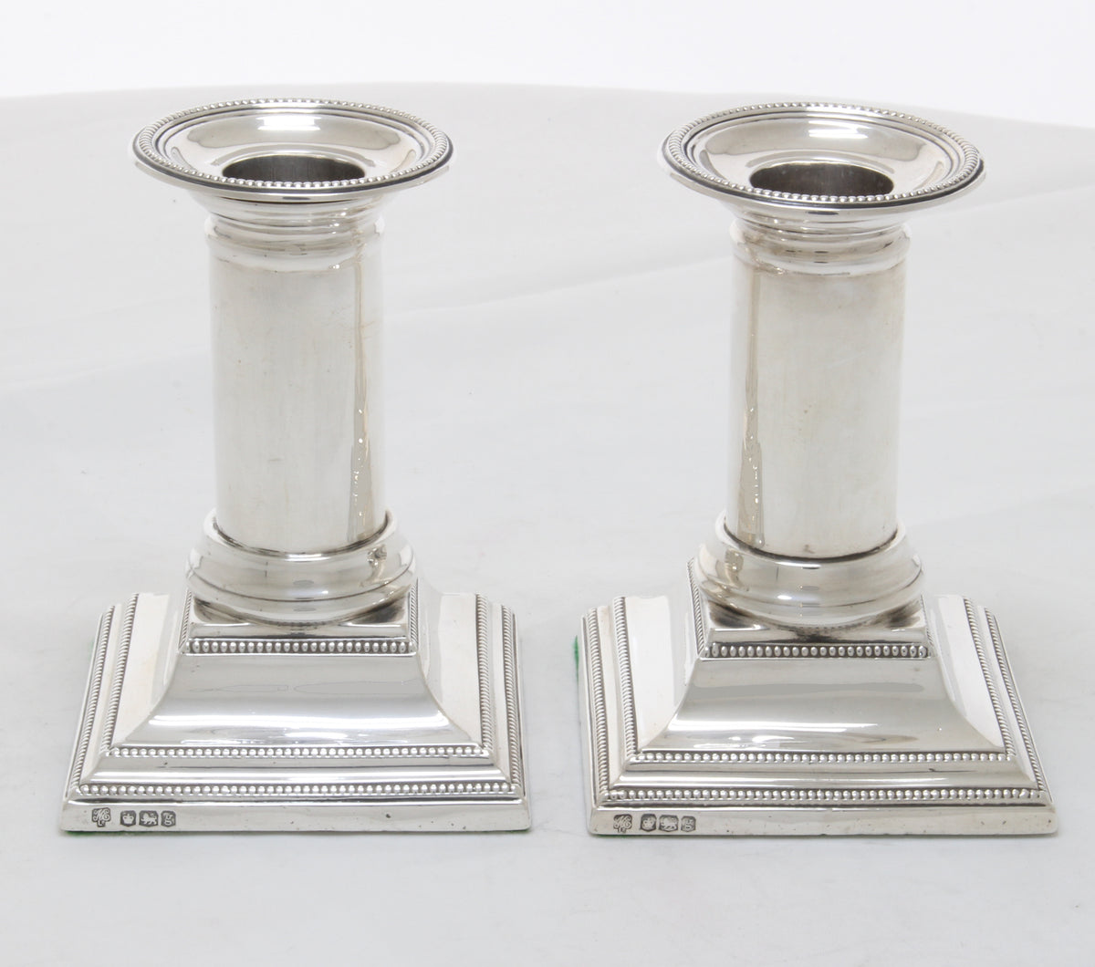 Very nice pair of small Corinthian candlesticks 1924