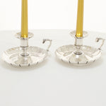 Crested pair of silver chambersticks