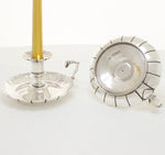 Crested pair of silver chambersticks with hallmarks for sterling