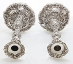 Massief zilveren kandelaars met veel decoratie